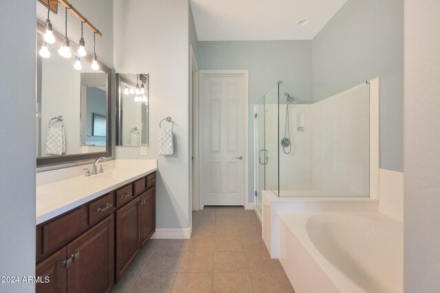 bathroom featuring tile patterned flooring and shower with separate bathtub