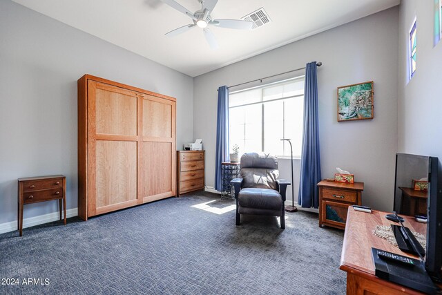 living area with ceiling fan and light tile patterned flooring