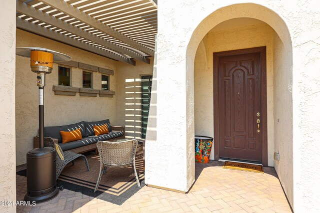 view of patio featuring outdoor lounge area and a pergola