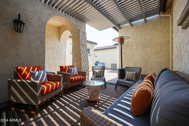 view of patio / terrace featuring an outdoor hangout area and a pergola