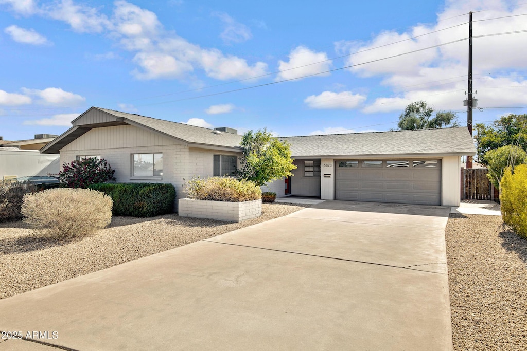 single story home featuring a garage