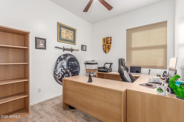 office with ceiling fan and light hardwood / wood-style floors