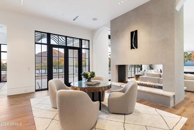 dining area featuring light hardwood / wood-style flooring and french doors