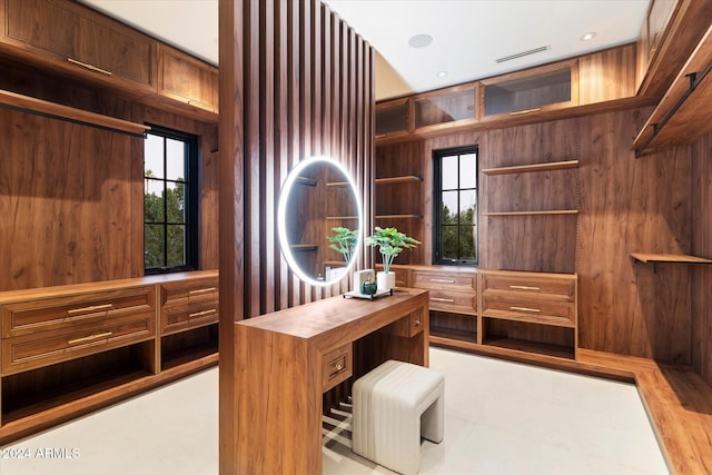 office area featuring wooden walls and visible vents