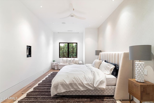 bedroom featuring ceiling fan and hardwood / wood-style floors