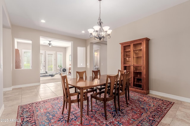 dining area with light tile patterned floors, baseboards, recessed lighting, and ceiling fan with notable chandelier