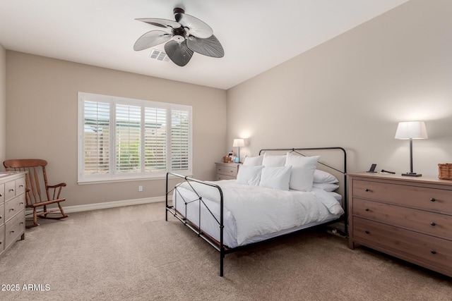 bedroom with baseboards, light carpet, visible vents, and ceiling fan