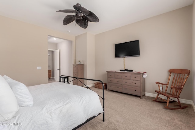 bedroom featuring baseboards, light colored carpet, and ceiling fan