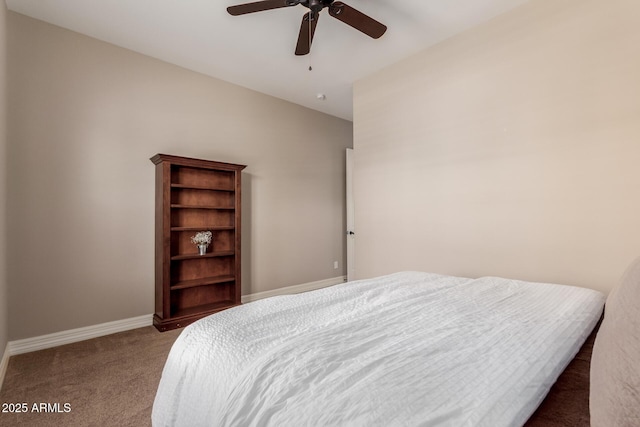 carpeted bedroom with baseboards and a ceiling fan