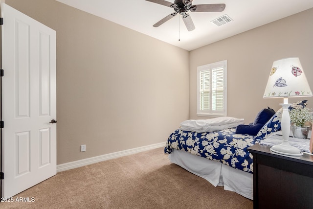 carpeted bedroom with visible vents, ceiling fan, and baseboards