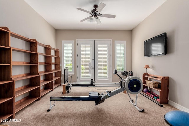 workout room with carpet flooring, baseboards, and ceiling fan