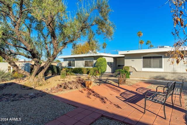 back of property with a patio area