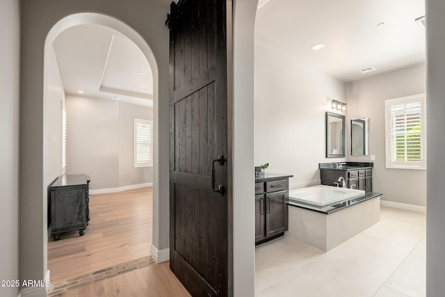 11070 E Bent Tree Dr, Scottsdale, AZ 85262 - bathroom featuring vanity, wood finished floors, and recessed lighting