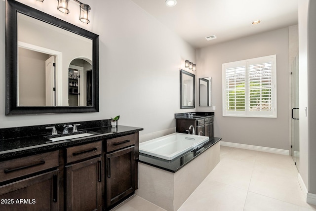 11070 E Bent Tree Dr, Scottsdale, AZ 85262 - full bath with two vanities, a garden tub, recessed lighting, and tile patterned floors