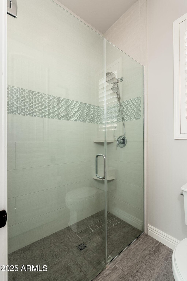 11070 E Bent Tree Dr, Scottsdale, AZ 85262 - bathroom featuring a stall shower and wood finished floors