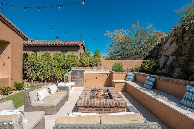 11070 E Bent Tree Dr, Scottsdale, AZ 85262 - view of patio featuring an outdoor living space with a fire pit and exterior kitchen