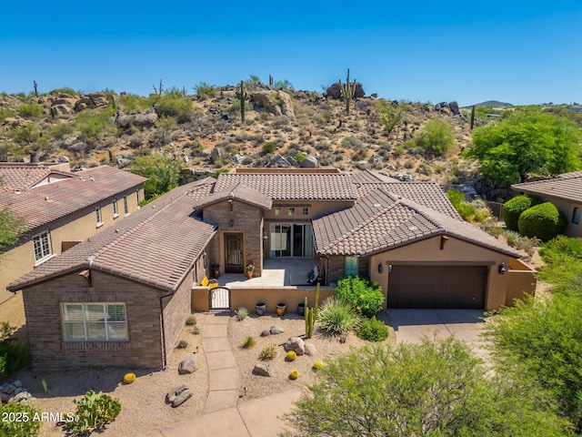 11070 E Bent Tree Dr, Scottsdale, AZ 85262 - view of front of home featuring a tile roof, a garage, concrete driveway, and brick siding