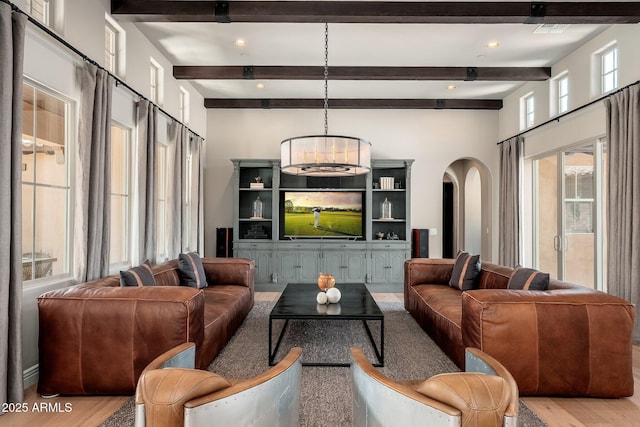 11070 E Bent Tree Dr, Scottsdale, AZ 85262 - living room featuring wood finished floors, arched walkways, beam ceiling, a chandelier, and recessed lighting