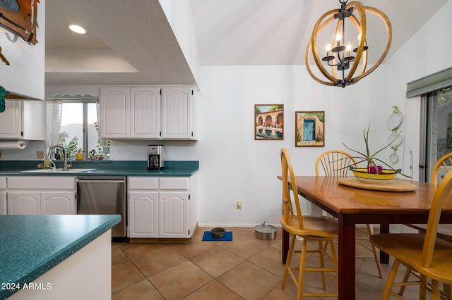 kitchen with dark countertops, white cabinets, and dishwasher