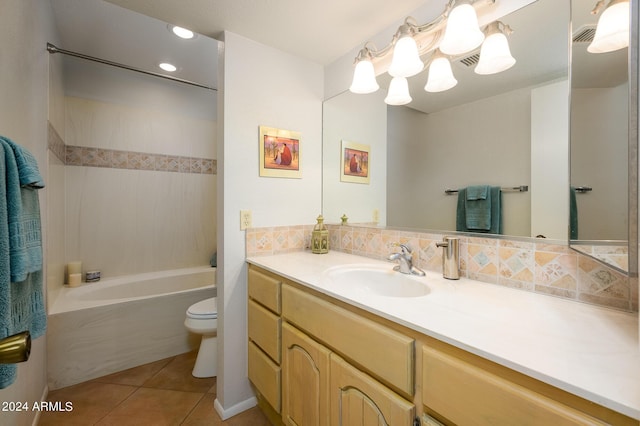 bathroom with visible vents, backsplash, toilet, vanity, and tile patterned flooring