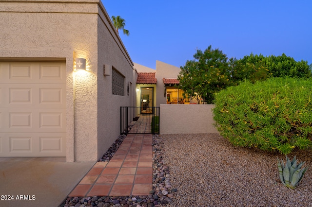 view of side of home with a garage