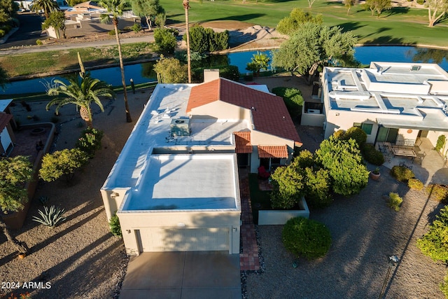 bird's eye view with view of golf course and a water view