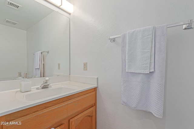 bathroom featuring visible vents and vanity