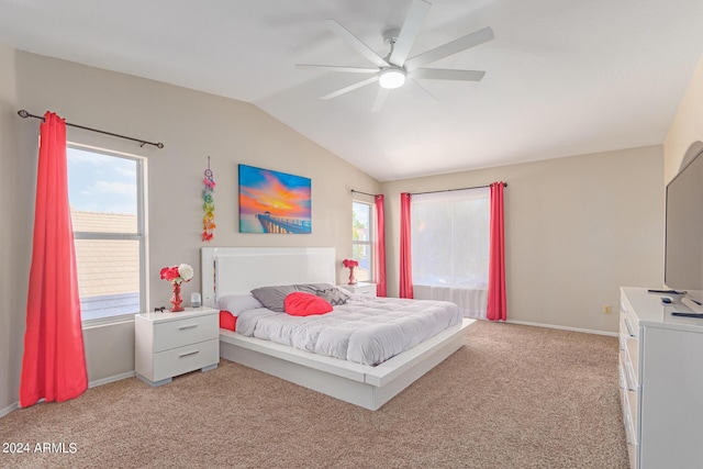 bedroom featuring a ceiling fan, light colored carpet, vaulted ceiling, and baseboards