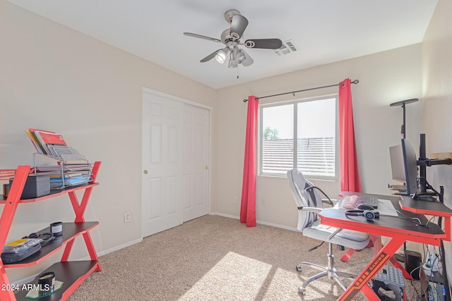 carpeted office with ceiling fan, visible vents, and baseboards