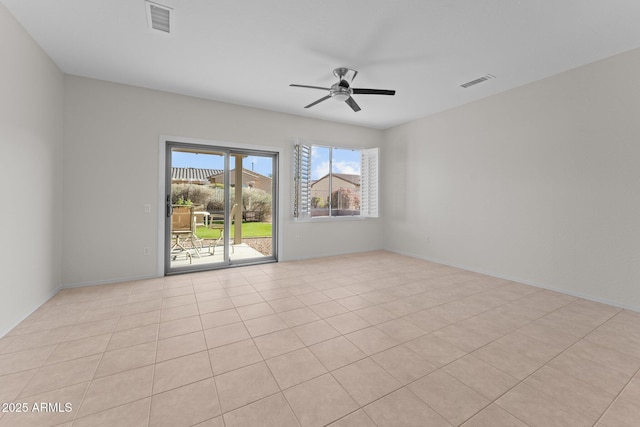 empty room with visible vents and ceiling fan