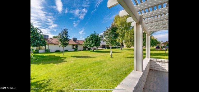 view of yard with a pergola