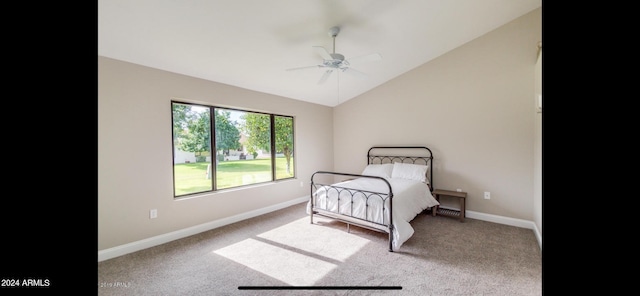 carpeted bedroom featuring vaulted ceiling and ceiling fan