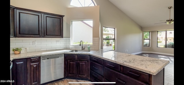 kitchen featuring sink, kitchen peninsula, dark brown cabinets, light hardwood / wood-style flooring, and dishwasher