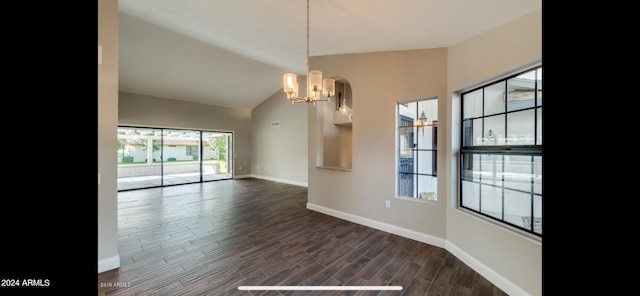 unfurnished room with dark hardwood / wood-style floors, vaulted ceiling, and a chandelier