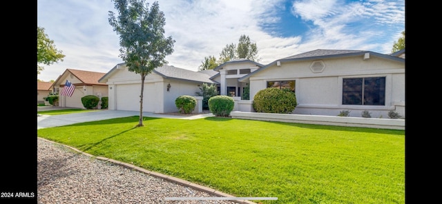 view of front facade with a garage and a front yard