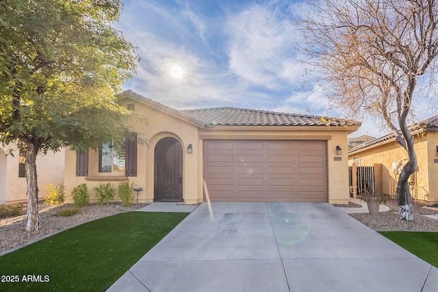 mediterranean / spanish house featuring a garage