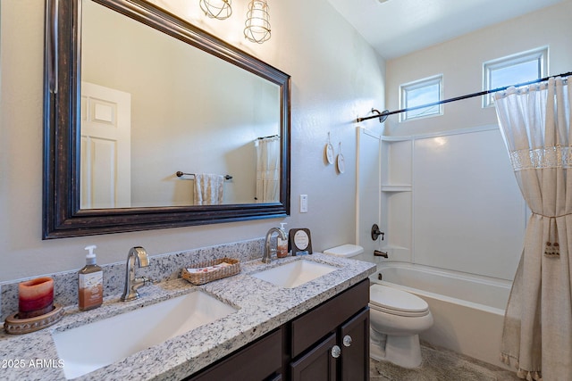 full bathroom with vanity, toilet, and shower / tub combo