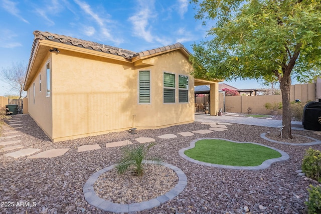 back of property featuring a patio