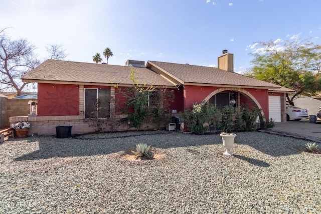 ranch-style home featuring a garage