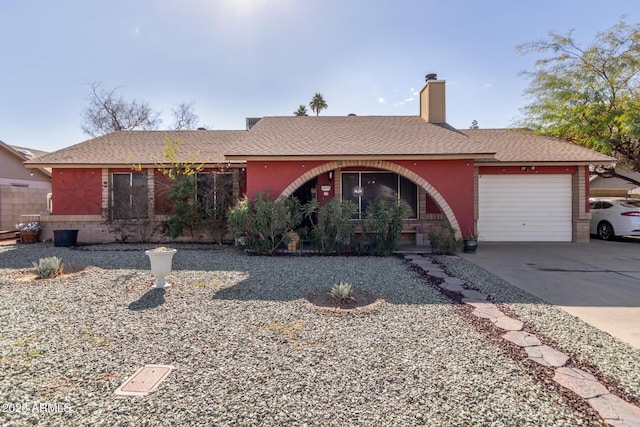 single story home featuring a garage