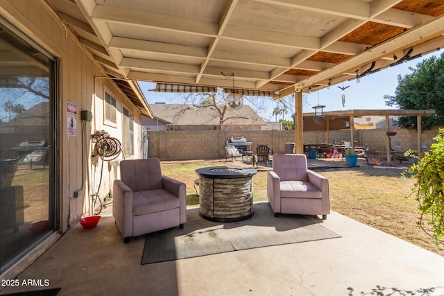 view of patio / terrace featuring an outdoor fire pit