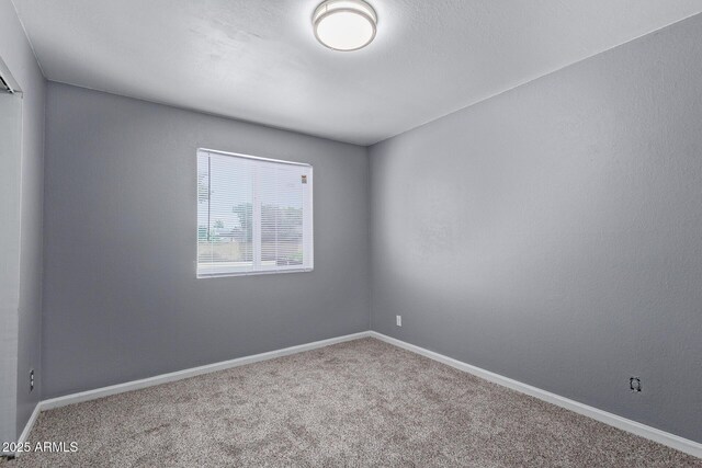 3539 W Davidson Ln, Phoenix, AZ 85051 - carpeted empty room featuring baseboards