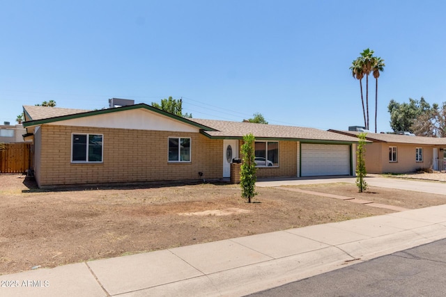 3539 W Davidson Ln, Phoenix, AZ 85051 - single story home with an attached garage, concrete driveway, and brick siding