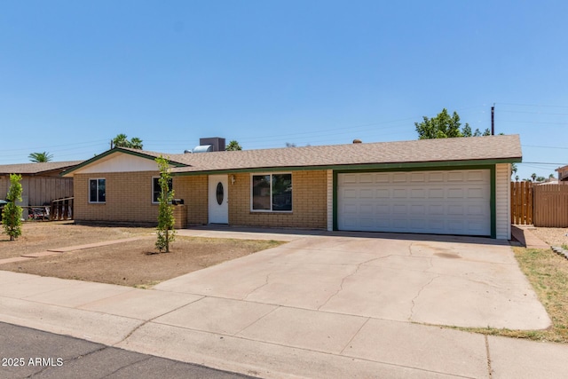 3539 W Davidson Ln, Phoenix, AZ 85051 - single story home with driveway, an attached garage, and brick siding