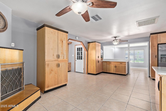 3539 W Davidson Ln, Phoenix, AZ 85051 - kitchen with ceiling fan, light tile patterned floors, light countertops, a peninsula, and light brown cabinetry