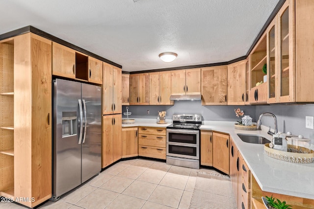 3539 W Davidson Ln, Phoenix, AZ 85051 - kitchen featuring appliances with stainless steel finishes, under cabinet range hood, light countertops, light tile patterned flooring, and a textured ceiling