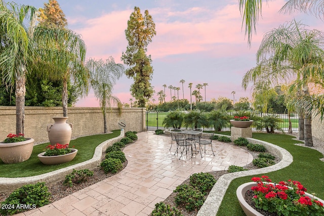 patio terrace at dusk with a yard