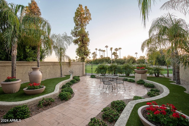 view of patio terrace at dusk