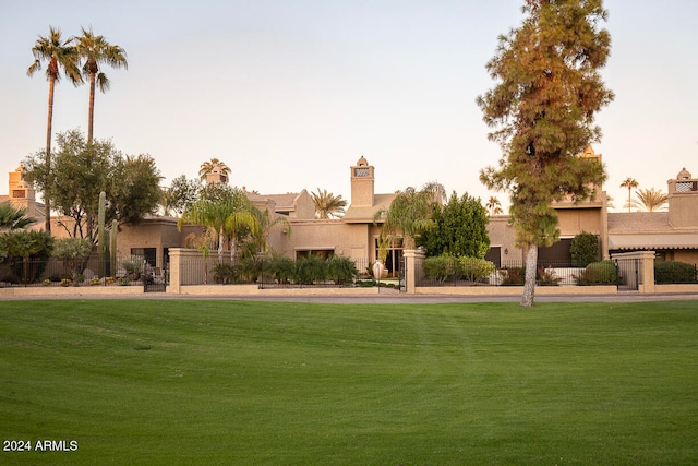 view of front of property with a yard