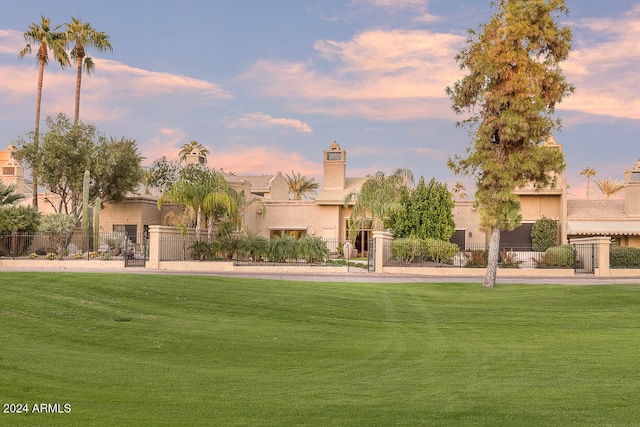 view of home's community with a lawn